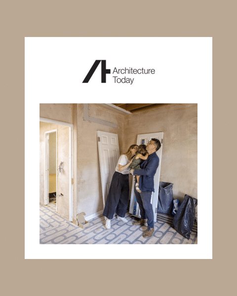Elisa Pardini and Robert Hall with their daughter in a bare-plastered room at home in Knightsbridge, on a card with the Architecture Today logo